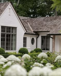 a house with white flowers in front of it