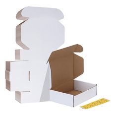 an open box with the lid opened next to a cardboard cutout for a cake