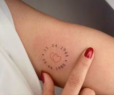 a woman's arm with the word love written in cursive writing on it