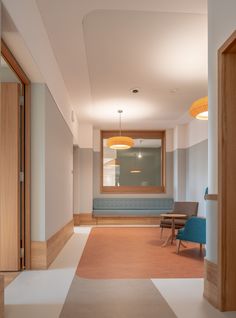 an empty room with two chairs and a table