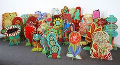 a group of colorfully painted wooden sculptures