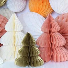 paper decorations are arranged in different colors and shapes