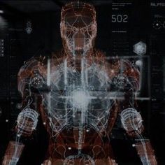 a futuristic man standing in front of a computer screen