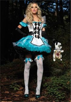 a woman in a blue and white dress holding a stuffed animal