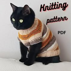 a black cat wearing a sweater sitting on top of a white couch with the caption knitting pattern