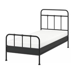 a metal bed frame with white sheets and black rails on the headboard, against a white background