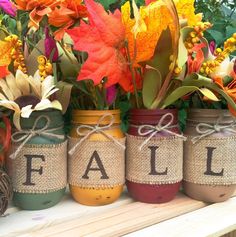 an instagram page with four mason jars filled with flowers and the words fall sale written on them