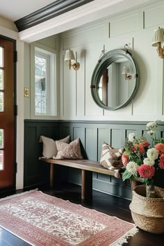 a room with a bench, mirror and rug