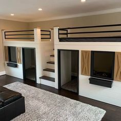 a living room with bunk beds and stairs