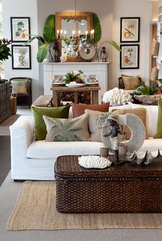 a living room filled with lots of furniture and decor