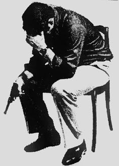 a black and white drawing of a man sitting on a chair with his head down