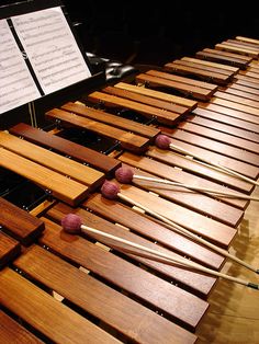 musical instruments sitting on top of wooden boards