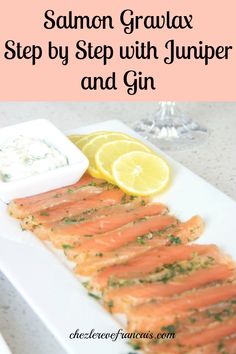 salmon on a white plate with lemons and garnish next to the caption reads salmon gravy step by step with jumper and gin