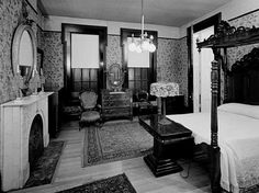 an old fashioned bedroom is shown in black and white