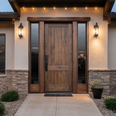 the front door of a house with lights on