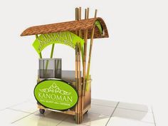 the kiosk is made out of bamboo and has a sign that says kaomanan restaurant