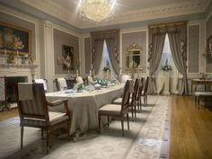 a formal dining room set up with white tablecloths and chairs