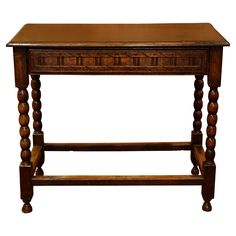 an old wooden table with two legs and a drawer on the top, isolated against a white background