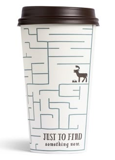 a white coffee cup with a brown lid and a maze design on the side that says just to find something now