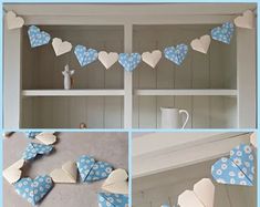 blue and white paper hearts hanging from a shelf