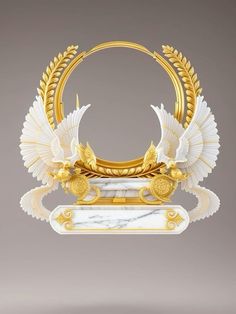 a white and gold sculpture with two birds on it