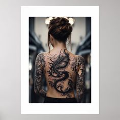 a woman with tattoos on her back standing in front of a mirror