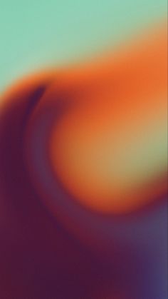 an abstract blurry background with orange and blue colors in the center, as seen from above