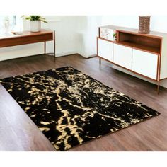 a black and gold area rug in a living room