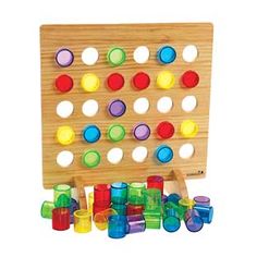 a wooden board game with plastic cups on it