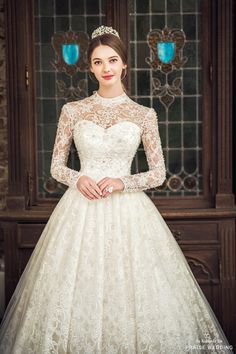 a woman in a white wedding dress posing for the camera