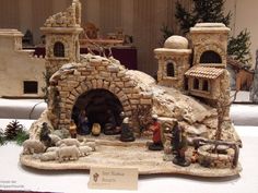 a nativity scene is displayed on a table