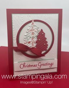 a christmas card with a red ribbon on the bottom and a tree in the middle