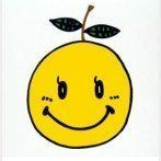 a yellow apple with a smiley face drawn on it's side and leaves sticking out of the top