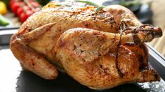 a close up of a chicken on a plate