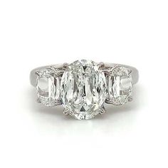 an oval and baguette diamond three stone ring