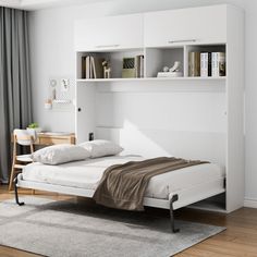 a white bed sitting next to a window with curtains on both sides and a book shelf above it