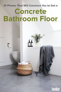 a white bathroom with a basket on the floor next to it and a toilet in the background