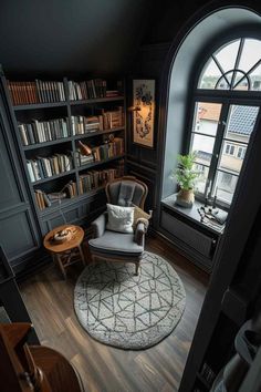 a living room filled with furniture and bookshelves in front of a large window