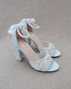 "Fun and flirty lace block heel sandals with pearl appliques. Perfect for weddings, parties, or any special occasion. DETAILS: HEEL HEIGHT: 3.6 inches COLORS AVAILABLE: Ivory, White and Light Blue UPPER: Synthetic upper and lining MATERIALS: Manmade outsole STYLE NAME: FAITH SIZE FIT: RUNS LARGE Not sure of which size to purchase? Shoes measurements are as follow: (Please note measurements taken the length of inside of shoe from toe to heel) SIZE 5 - 9.25\" SIZE 6 - 9.50\" SIZE 7 - 9.75\" SIZE 8 Quince Heels, Light Blue Crochet, Light Blue Heels, Pearl Applique, Quinceanera Shoes, Bridesmaids Shoes, Blue High Heels, Bridal Heels, Rancho Cucamonga