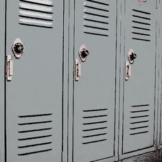 a row of gray lockers sitting next to each other