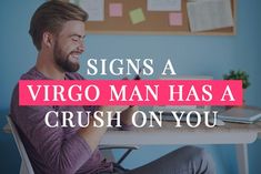 a man sitting at a desk with his cell phone in his hand and the words signs a virgo man has a crush on you