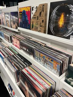 the shelves are full of various records and cds