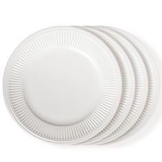 four white plates stacked on top of each other