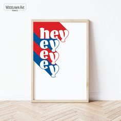 a framed poster with the words hey bye in red, white and blue on it