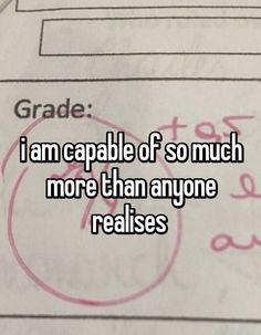 someone is writing on paper that says i am capable of so much more than anyone realises