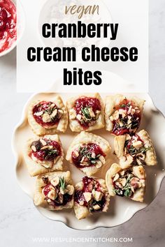 These festive vegan cranberry cream cheese bites are the perfect appetizer for your next holiday party! They're creamy, delicious, and so easy to make with puff pastry, cranberry sauce, chopped hazelnuts, vegan cream cheese, and garnished with fresh rosemary.