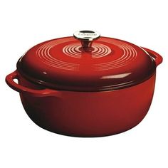 a red casserole dish with a lid and handle on the side, sitting in front of a white background