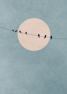 birds sitting on a wire with the moon in the background