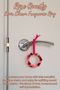 a door handle with a ring hanging from it and the words rose quartz above it