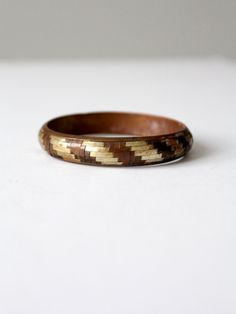 "This is a 1970s vintage mixed metal cuff bangle  The copper, brass, and silver tone slip-on bracelet has a basket weave design.  CONDITION In good condition with wear consistent with age and use. There is a small dent and some scuffs.  MEASUREMENTS Width:  1/2\"  .. 1.3 cm Exterior Circumference:  9.25\"  ..  23.5 cm Interior Diameter: 2.625\" ...  6.7 cm 91831" Vintage Gold Bangle Made Of Copper, Vintage Gold Copper Bangle, Vintage Gold-colored Copper Bangle, Vintage Copper Bangle In Gold Color, Brown Copper Bangle, Vintage Copper Bangle, Victorian Shoes, Hippie Boots, Suede Belt